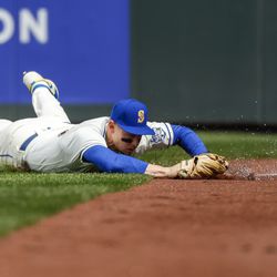 Seattle Mariners rightfielder Jarred Kelenic (10) makes a failing attempt to catch a fly ball against the Cleveland Guardians during the sixth inning at T-Mobile Park