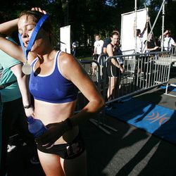 Jenn Shelton receives her medal after winning the women's division of the 2010 Deseret News Marathon Saturday.