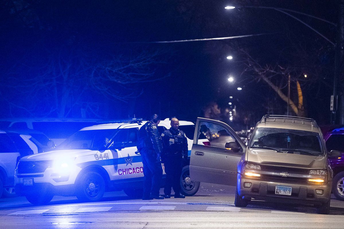 Chicago police investigate a man shot, Monday night in the 2600 block of South Spaulding, in the Little Village neighborhood. | Tyler LaRiviere/Sun-Times