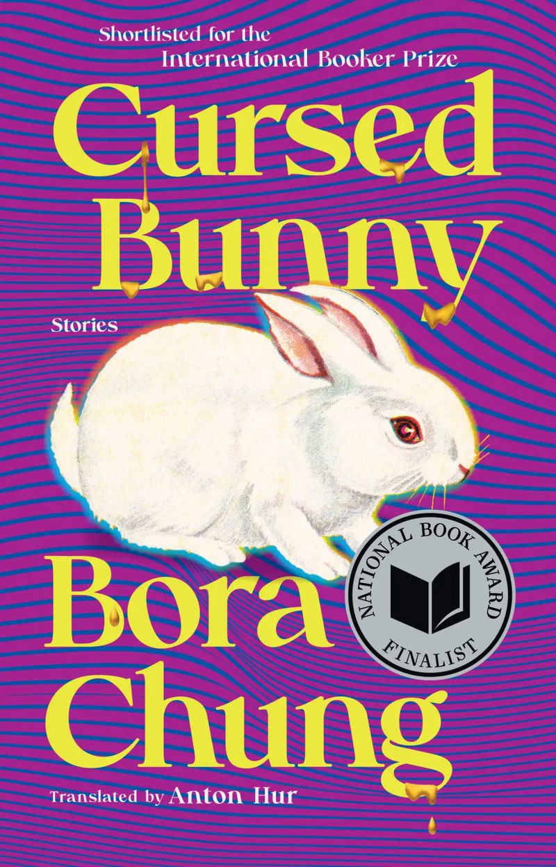 Book cover with blue and purple rippled stripes, with psychedelic undertones, with a white photorealistic bunny in the center.