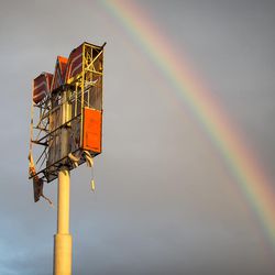 A rainbow appears over over a Whataburger sign that was destroyed by Hurricane Harvey in Refugio, Texas, Monday, Aug. 28, 2017.