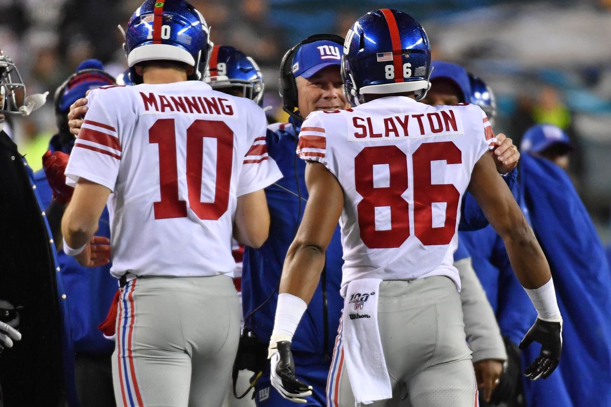 New York Giants head coach Pat Shurmur celebrates with quarterback Eli Manning and wide receiver Darius Slayton after 35-yard touchdown during the second quarter against the Philadelphia Eagles at Lincoln Financial Field.