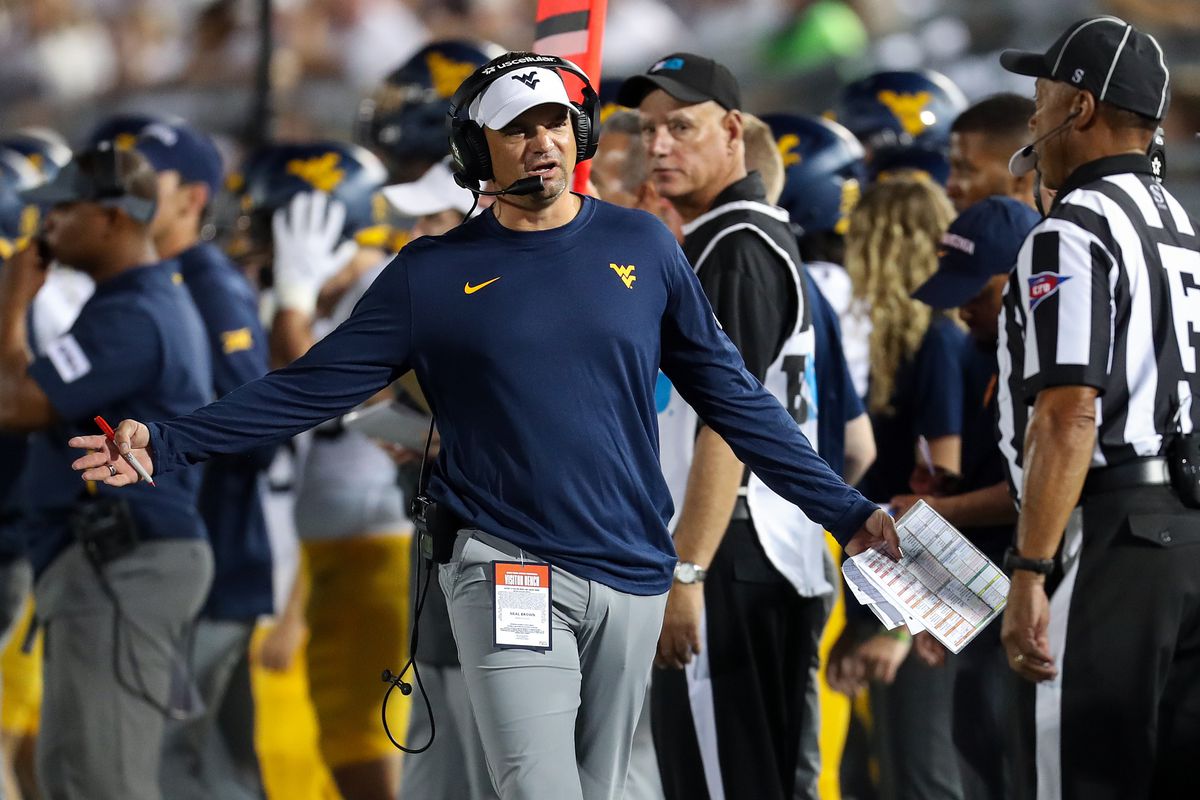 West Virginia Mountaineers head coach Neal Brown argues a call with a referee during the third quarter against the Penn State Nittany Lions at Beaver Stadium. Penn State defeated West Virginia 38-15.