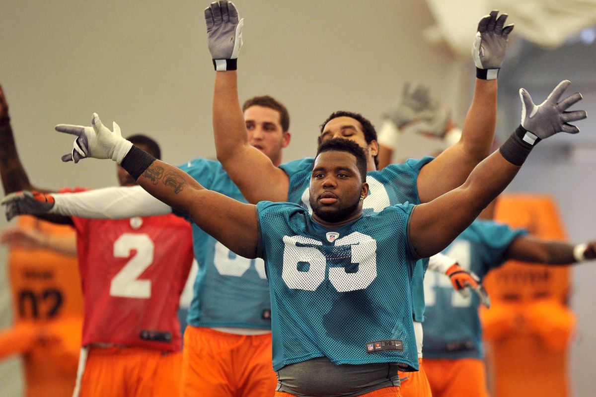 May 4, 2012; Davie, FL, USA; Miami Dolphins guard Derek Dennis (63) during drills at rookie mini-camp practice at the Dolphins training facility. Mandatory Credit: Steve Mitchell-US PRESSWIRE
