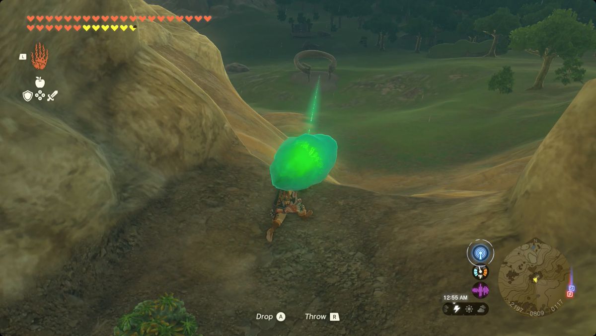 The Legend of Zelda: Tears of the Kingdom Link carrying the Usazum Shrine crystal out of Satori Mountain Foothill Cave.