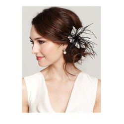Floral Feather Pin, $45 at <a href="http://www.anntaylor.com/ann/product/AT-Accessories/AT-View-All/Floral-Feather-Pin/305140?colorExplode=false&skuId=13189396&catid=cata000025&productPageType=search&defaultColor=9045">Ann Taylor</a>
