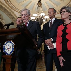 Senate Majority Leader Mitch McConnell of Ky., pauses while speaking to the media after a weekly policy luncheon, Tuesday, July 16, 2019, in Washington, joined by Sen. John Barrasso, R-Wyo., left, Sen. John Thune, R-S.D., and Sen. Joni Ernst, R-Iowa. (AP Photo/Jacquelyn Martin)