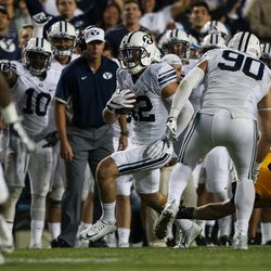Brigham Young Cougars defensive back Kai Nacua (12) runs back an interception in the fourth quarter of a game against the Toledo Rockets at LaVell Edwards Stadium in Provo on Friday, Sept. 30, 2016.
