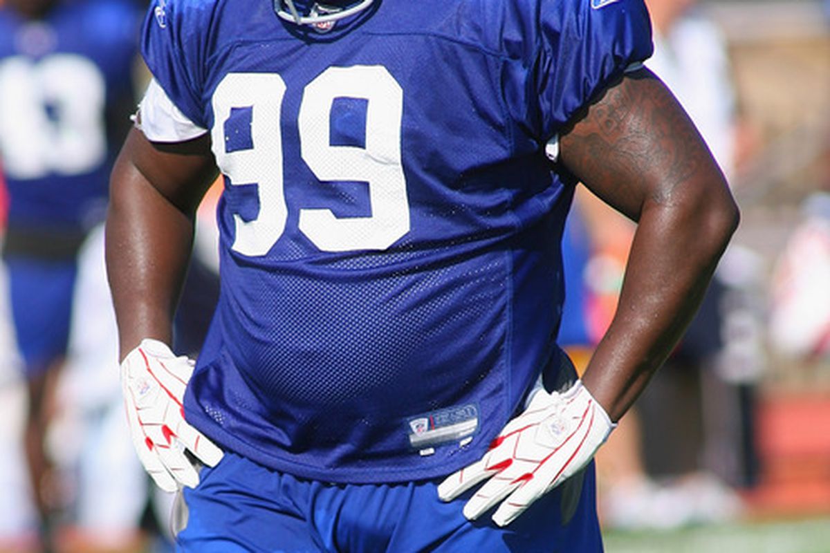 PITTSFORD, NY - AUGUST 08:  Marcell Dareus #99 (blue) of the Buffalo Bills readies for a play during Buffalo Bills Training Camp at St. John Fisher College on August 8, 2011 in Pittsford, New York.  (Photo by Rick Stewart/Getty Images)