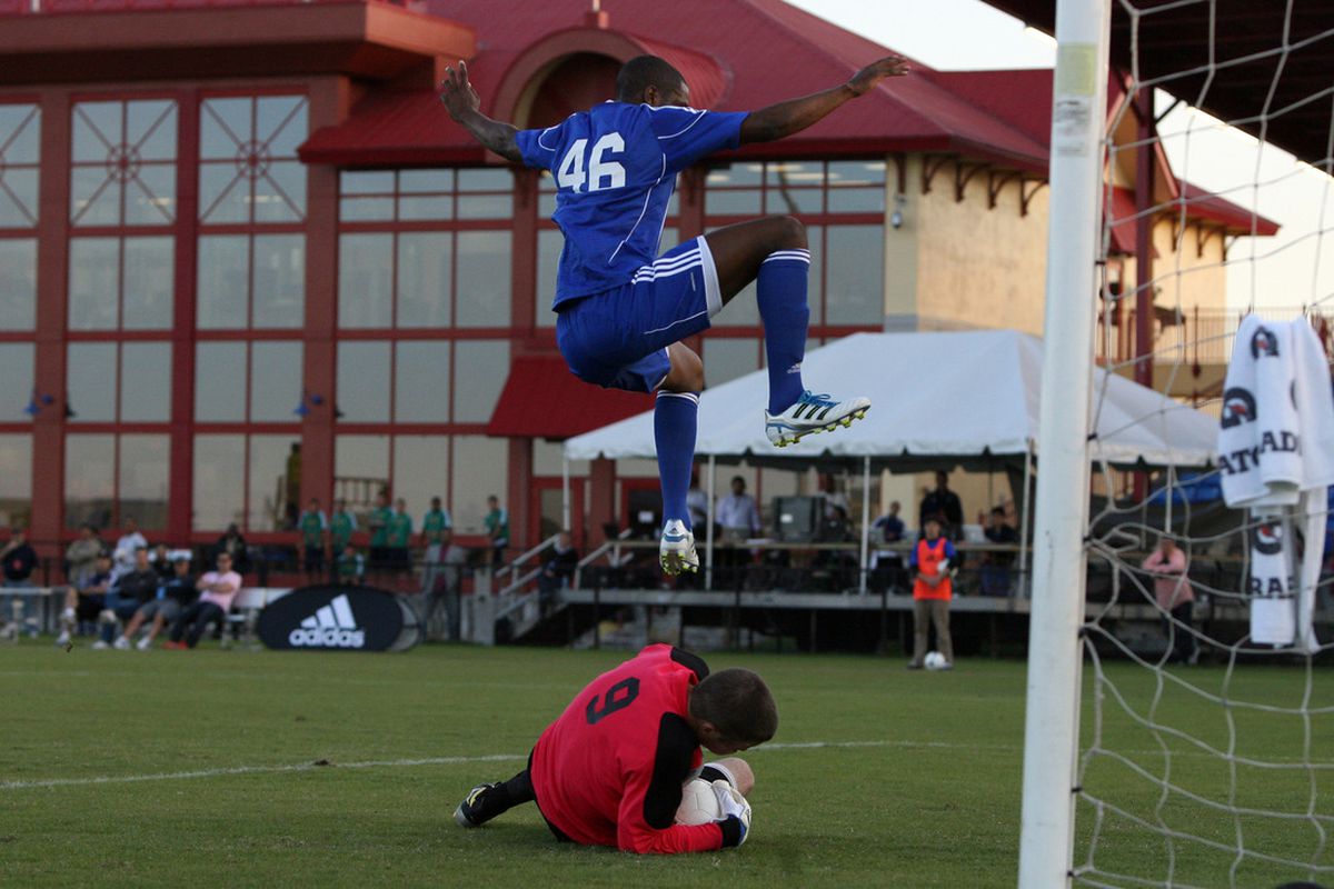 Able to leap tall goal keepers in a single bound!  Its 12th overall pick Aaron Maund! (seriously this is the best picture of him in the MLSsoccer.com collection from combine and draft!)