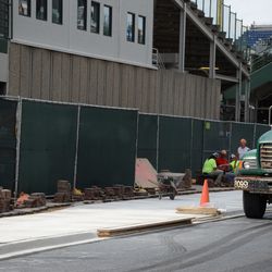 4:18 p.m. Pavement bricks being reinstalled, along the newly-laid sidewalk - 