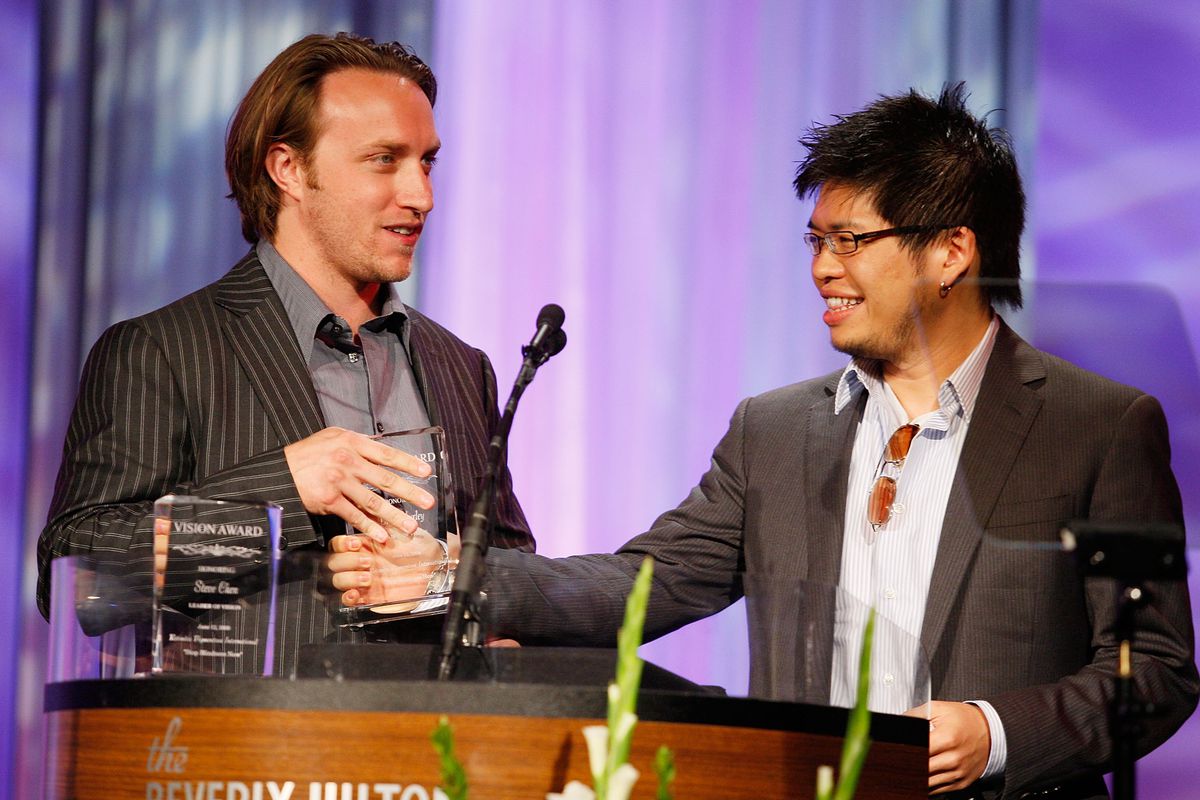 YouTube co-founders Chad Hurley and Steve Chen stand at a podium to accept an award in 2008.