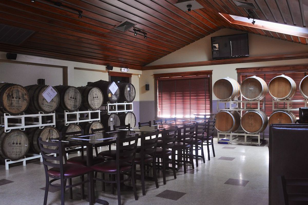 A dining room at Fire N Brew doubles as a barrel-aging facility for Hidden Cove.
