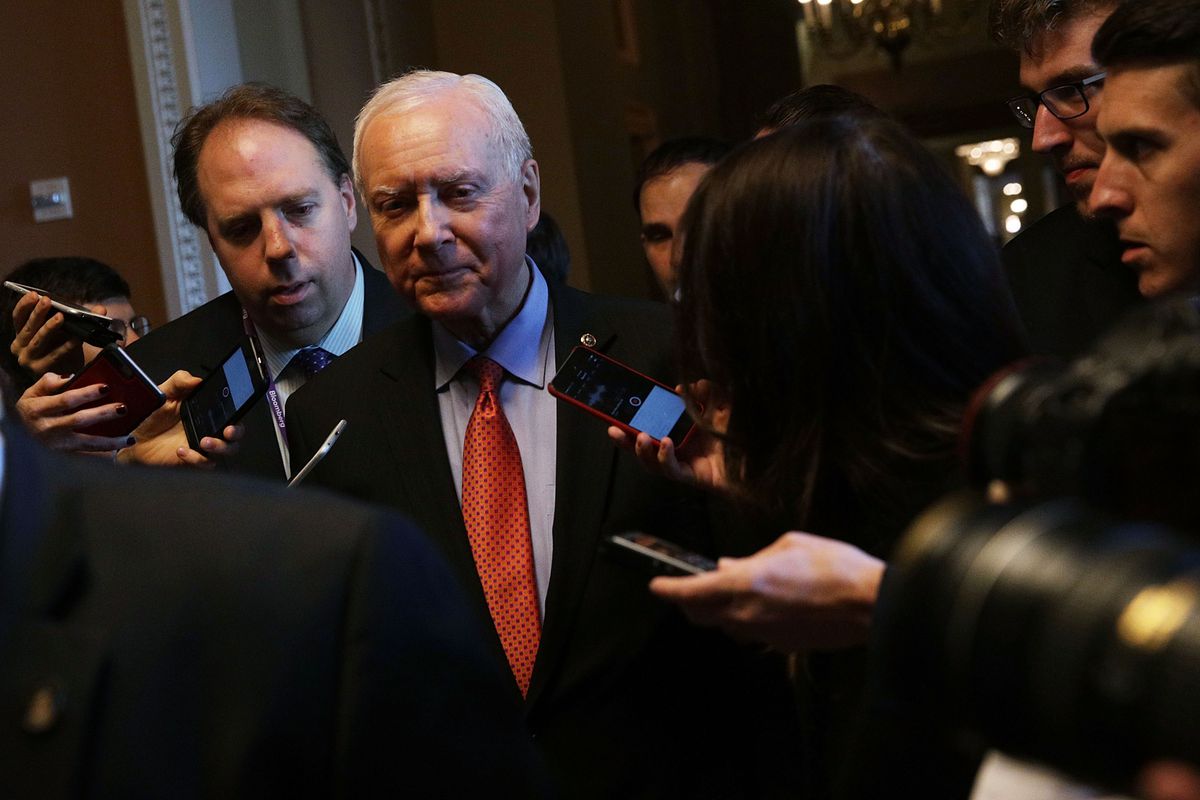 Sen. Orrin Hatch surrounded by reporters.