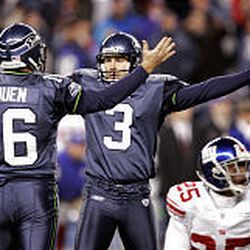 Seattle Seahawks kicker Josh Brown turns toward holder Tom Rouen after kicking a 36-yard field goal in overtime to beat the New York Giants.