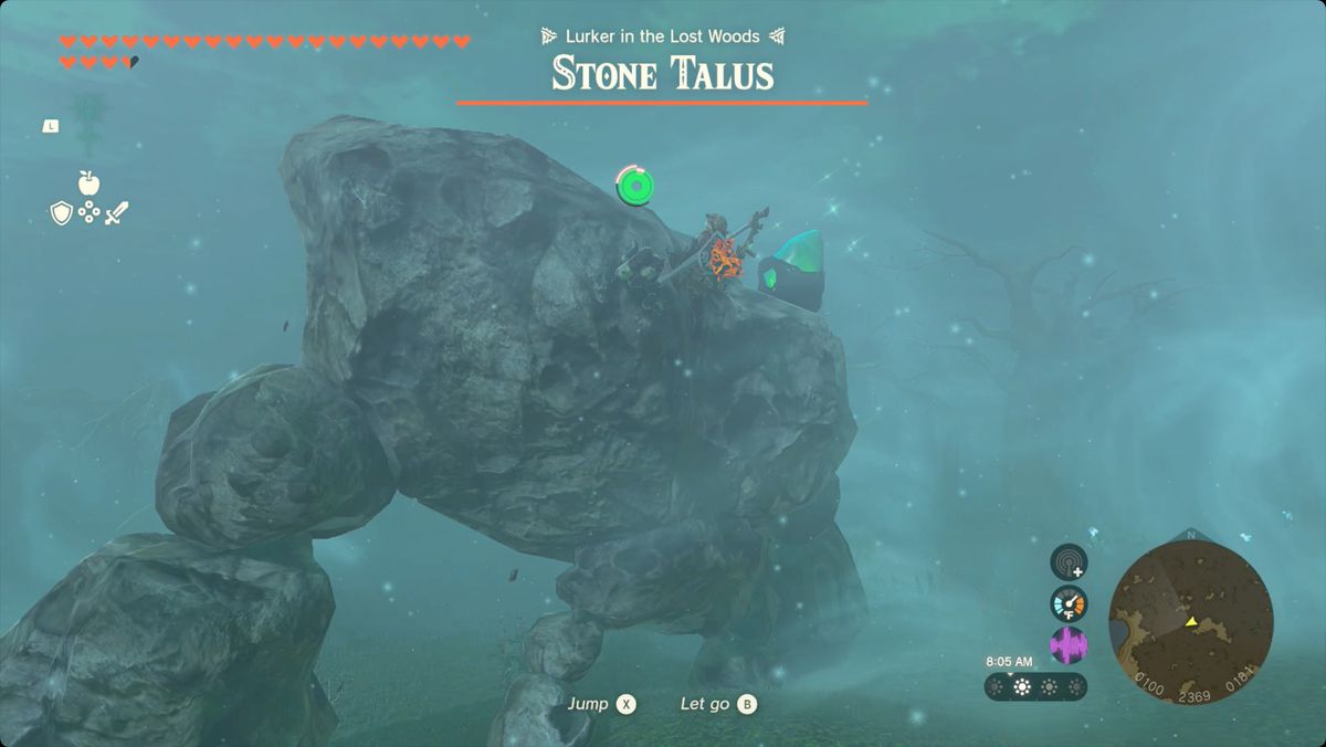 The Legend of Zelda: Tears of the Kingdom Link climbing onto a Stone Talus with a shrine crystal embedded in its head
