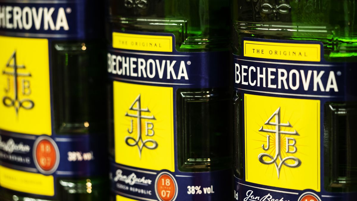 Becherovka seen on the store shelf. Becherovka, formerly Karlsbader Becherbitter, is a herbal bitter, often drunk as a digestive aid, that is produced in Karlovy Vary, Czech Republic by the Jan Becher company. The brand is owned by Pernod Ricard.