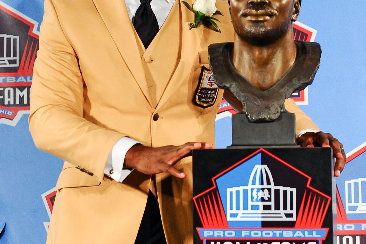 Aug 4, 2012; Canton, OH, USA; Curtis Martin poses with his bust at the 2012 Pro Football Hall of Fame Enshrinement at Fawcett Stadium. Mandatory Credit: Tim Fuller-US PRESSWIRE