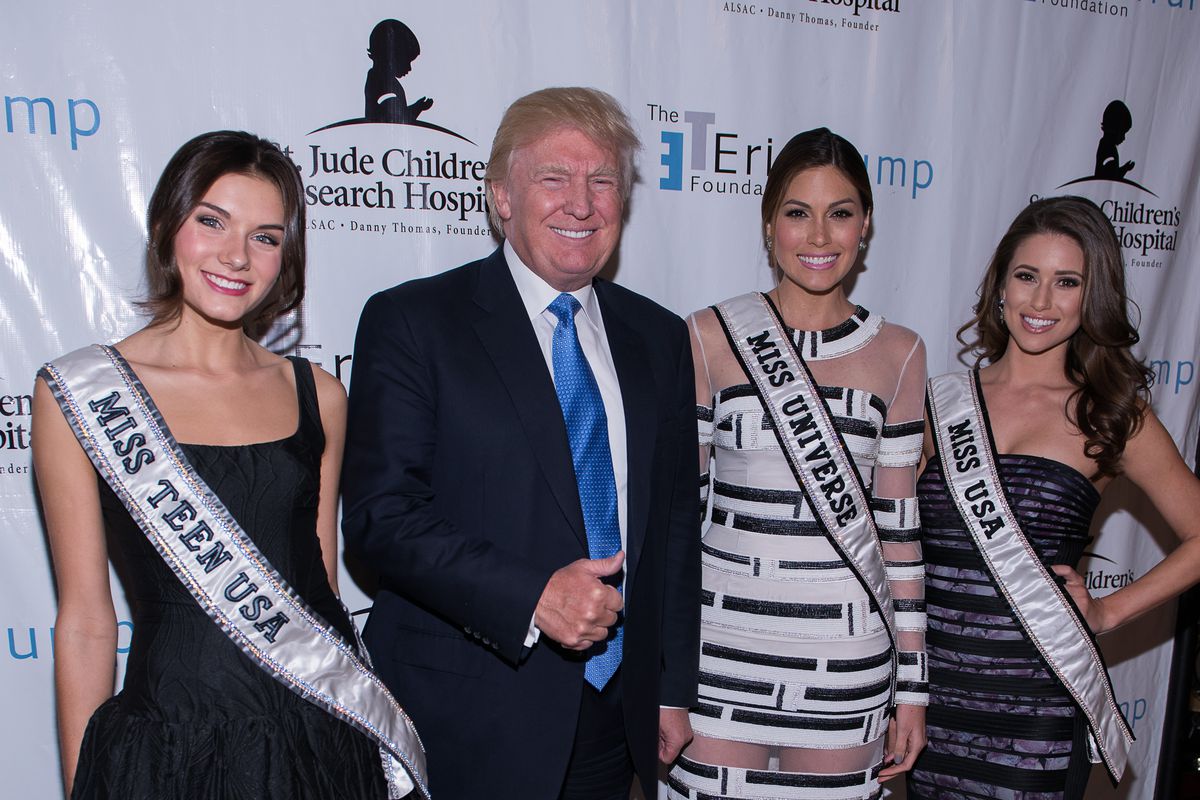 Miss Teen USA K. Lee Graham, Donald Trump, Miss Universe Gabriela Isler, and Miss USA Nina Sanchez attend The Eric Trump 8th Annual Golf Tournament at Trump National Golf Club Westchester on September 15, 2014 in Briarcliff Manor, New York.