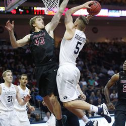 Brigham Young Cougars guard Kyle Collinsworth (5) drives on Santa Clara Broncos forward Nate Kratch (43) during the WCC tournament in Las Vegas Saturday, March 5, 2016. BYU won 72-60. 
