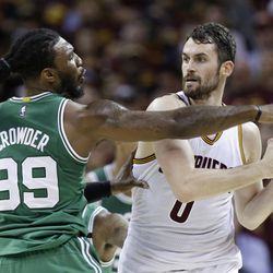 Boston Celtics' Jae Crowder (99) defends against Cleveland Cavaliers' Kevin Love (0) during the first half of Game 4 of the NBA basketball Eastern Conference finals, Tuesday, May 23, 2017, in Cleveland. (AP Photo/Tony Dejak)