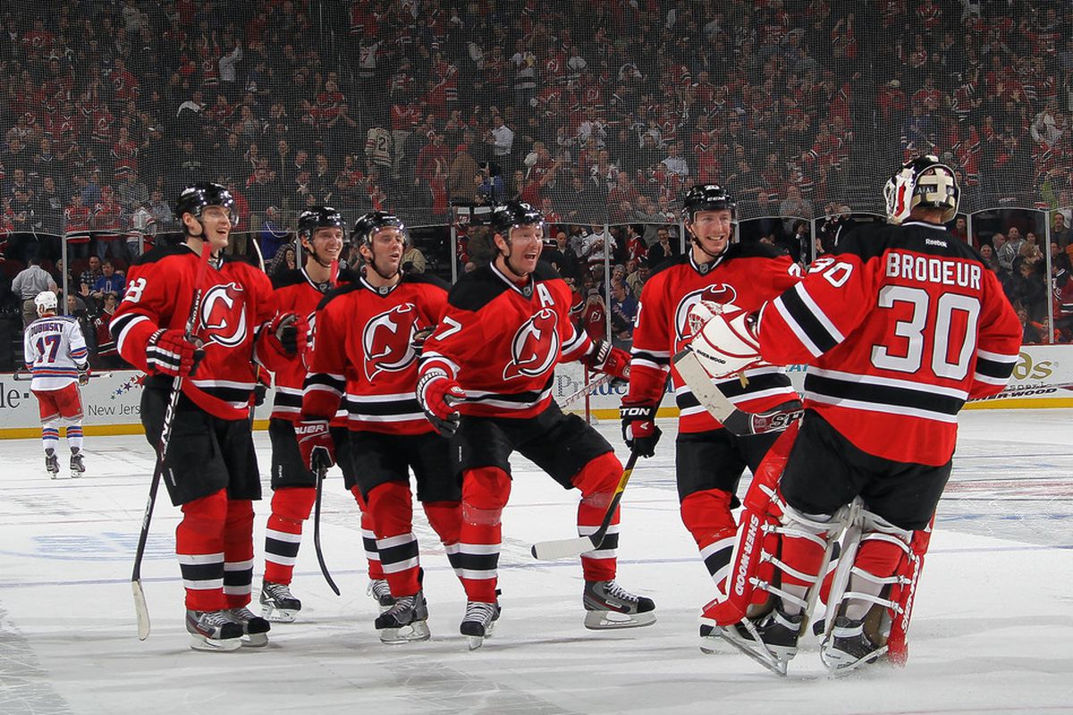 Your winners for the evening: THE New Jersey Devils and not Brandon Dubinsky in the background.  (Photo by Bruce Bennett/Getty Images)
