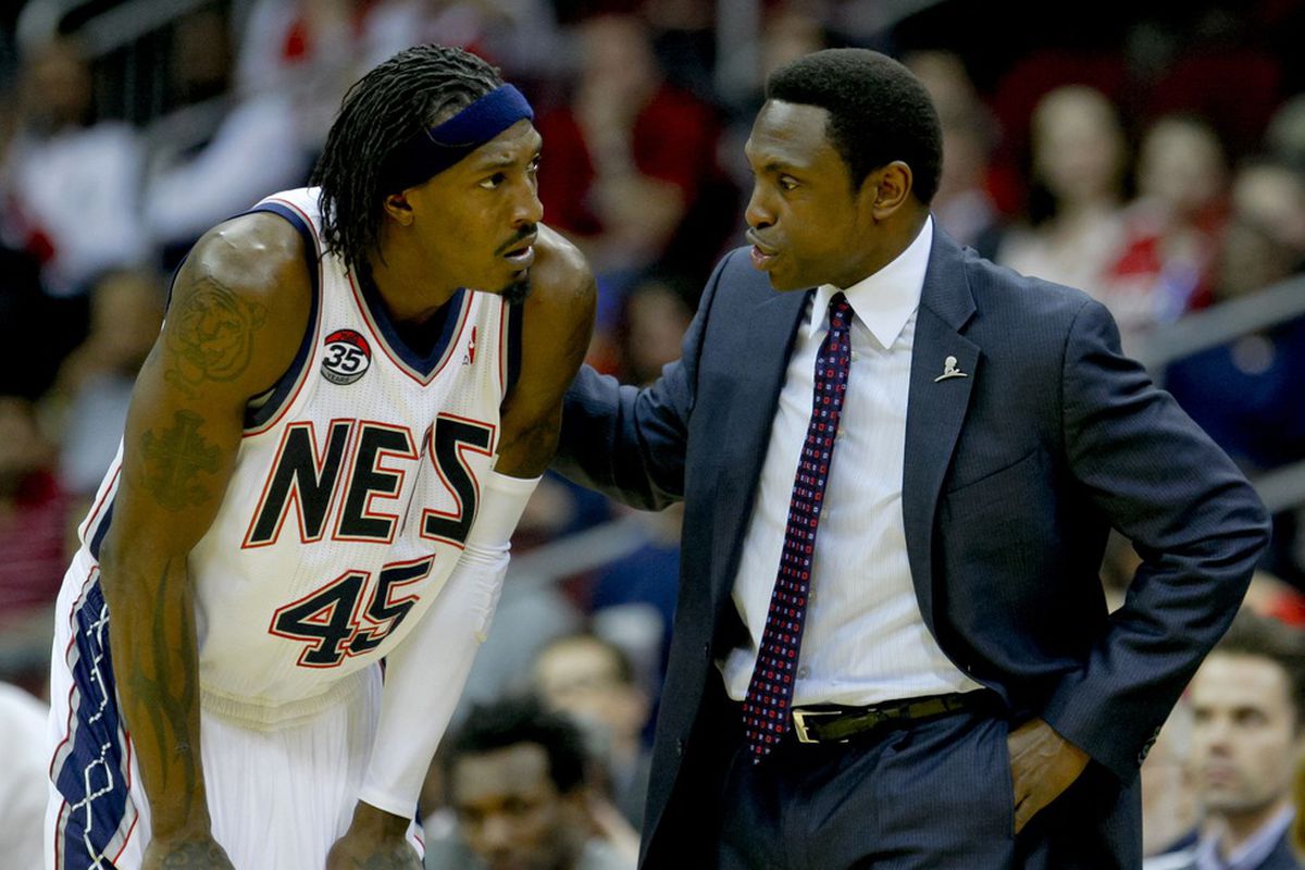 Mar 26, 2012; Newark, NJ, USA;  New Jersey Nets small forward Gerald Wallace (45) and head coach Avery Johnson talk during a timeout against the Utah Jazz at the Prudential Center. The Jazz won 105-84. Mandatory Credit: Jim O'Connor-US PRESSWIRE