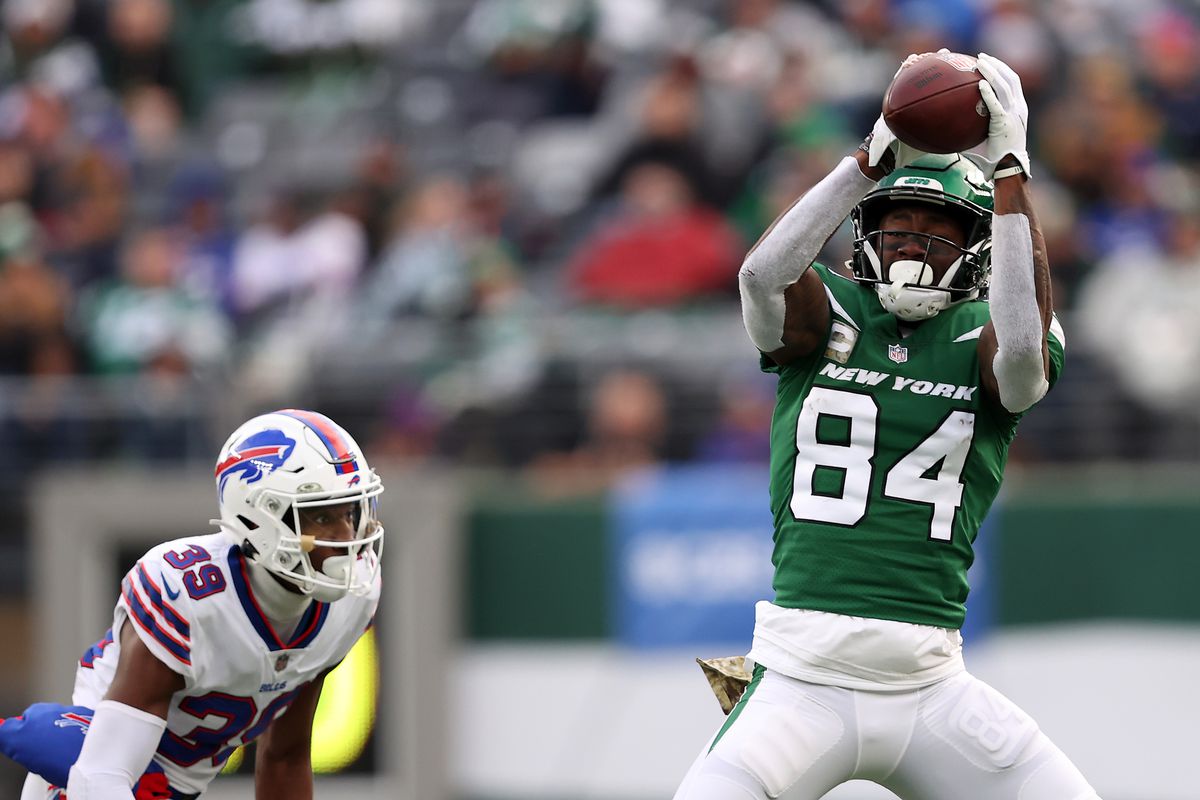 Corey Davis #84 of the New York Jets makes a catch in the third quarter against the Buffalo Bills at MetLife Stadium on November 14, 2021 in East Rutherford, New Jersey.