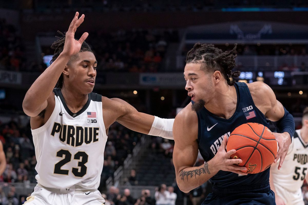 Purdue Boilermakers guard Jaden Ivey (23) guards Penn State Nittany Lions forward Seth Lundy (1) during the Big Ten tournament on Friday, March. 11, 2022, at Gainbridge Fieldhouse in Indianapolis. Purdue Boilermakers defeated the Penn State Nittany Lions, 69-61.&nbsp;