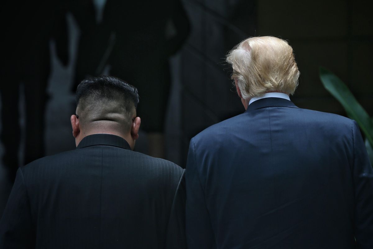 North Korean leader Kim Jong Un and President Donald Trump walk side by side during their historic summit on June 12, 2018, in Singapore.