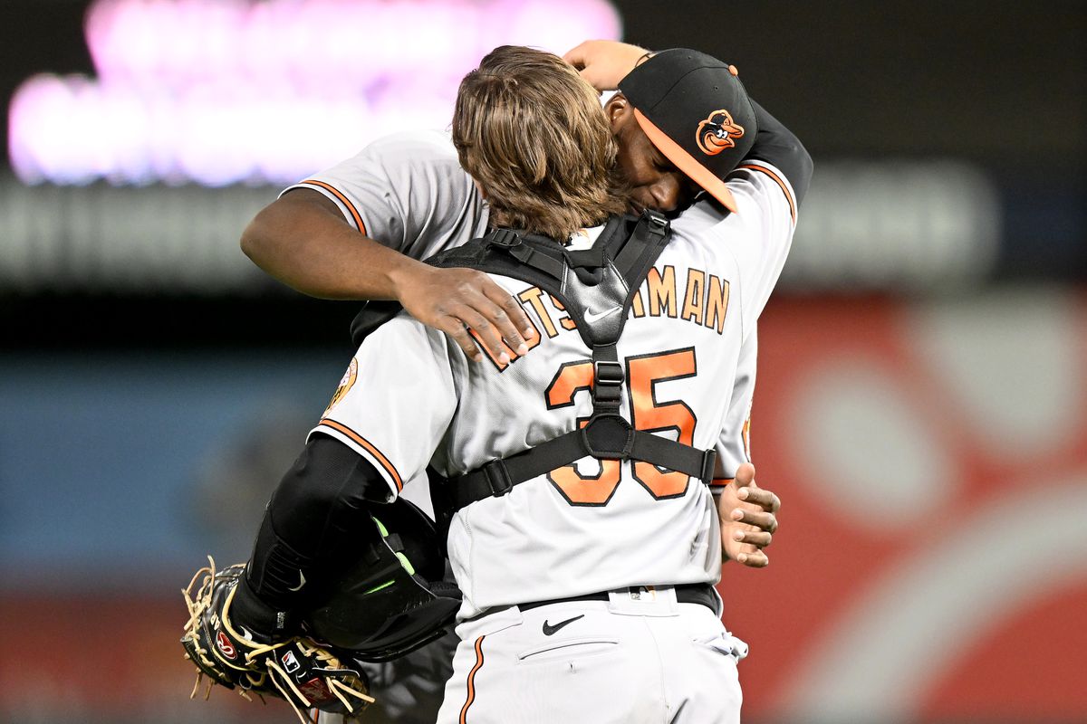 Felix Bautista of the Baltimore Orioles celebrates with Adley Rutschman after a 1-0 victory against the Washington Nationals at Nationals Park on April 18, 2023 in Washington, DC.