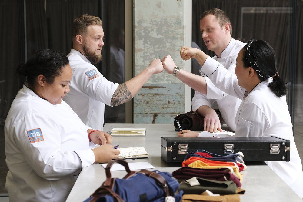 Chefs Luke Kolpin and Jackson Kalb bump fists.