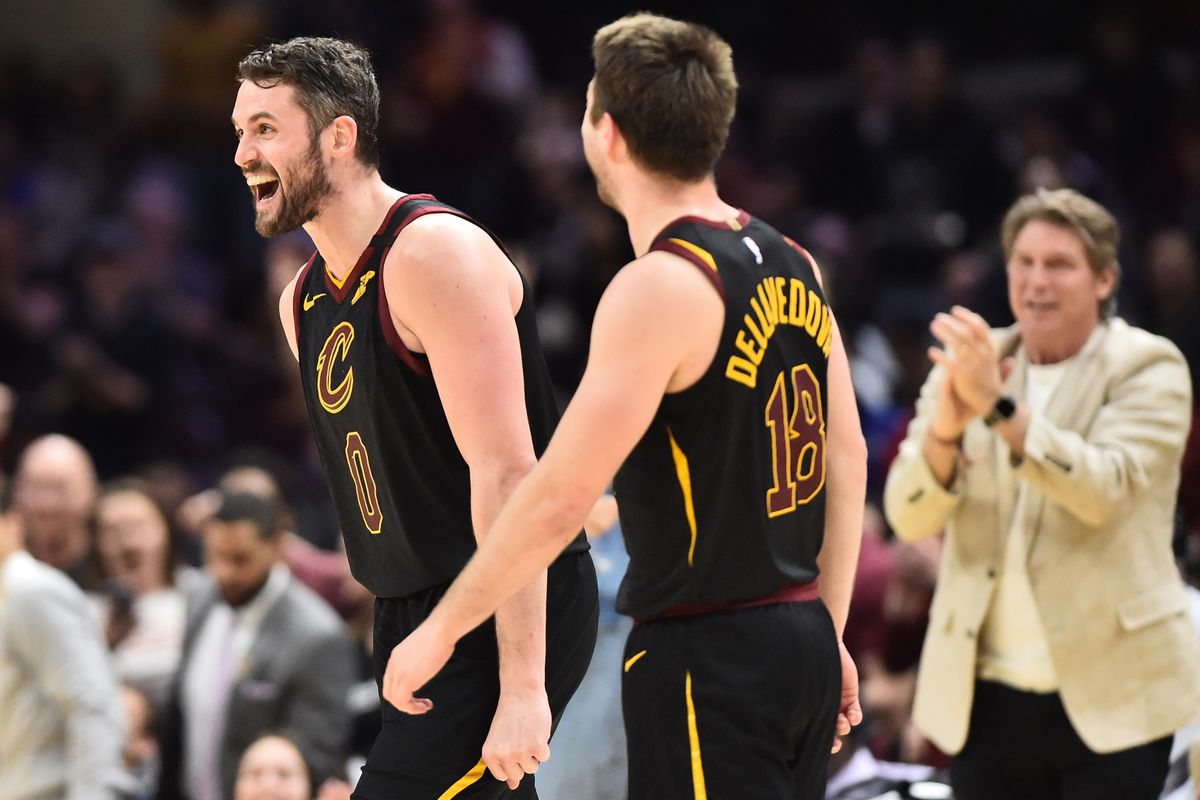Cavaliers guard Matthew Dellavedova (18) and forward Kevin Love (0) celebrate after Love scored during overtime against the San Antonio Spurs at Rocket Mortgage FieldHouse.
