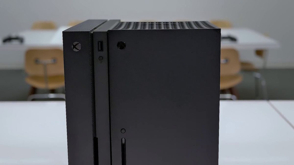 An Xbox One X standing next to an Xbox Series X standing vertically