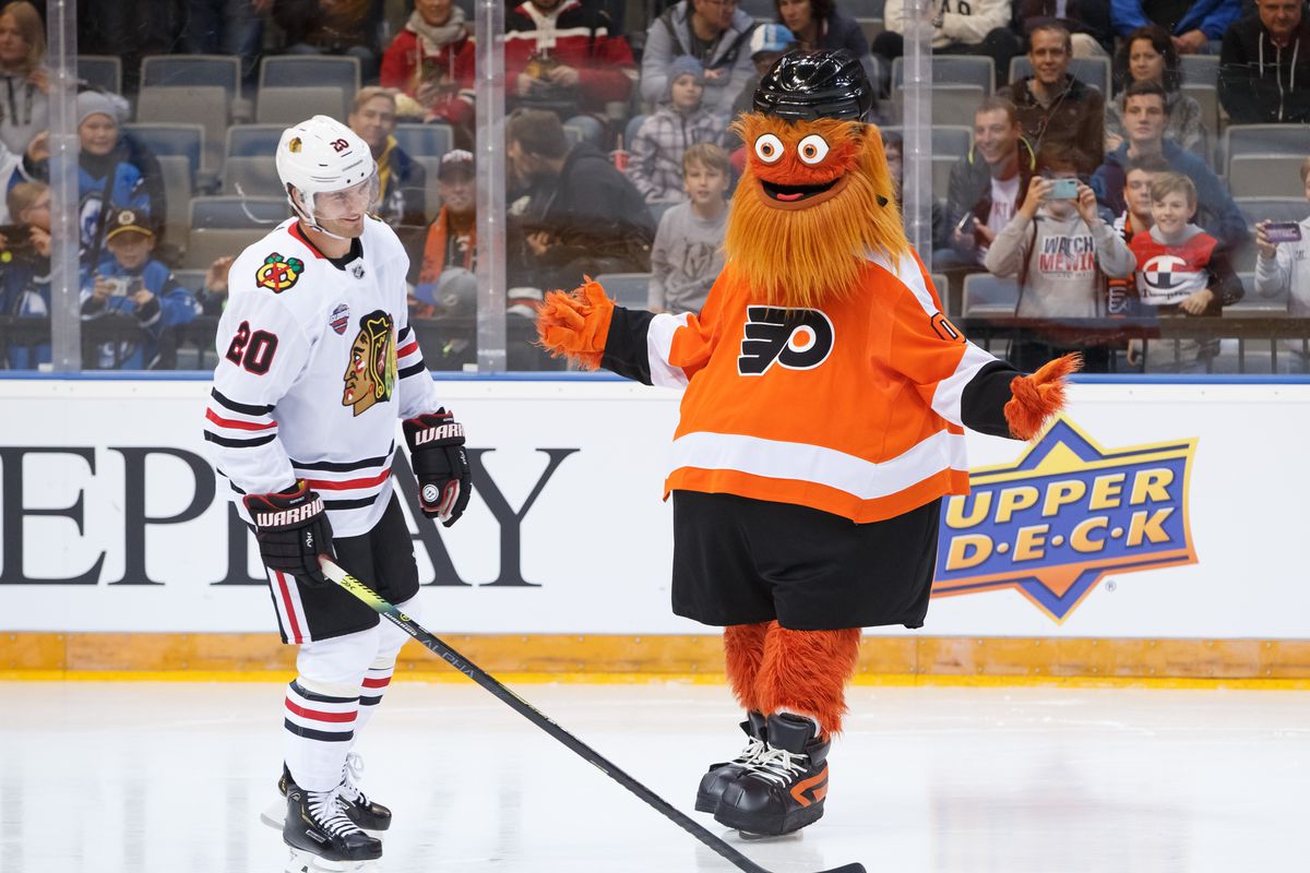 Philadelphia Flyers mascot Gritty jokes with Brandon Saad #20 of the Chicago Blackhawks during a skills competition before the Global Series Challenge game at O2 Arena on October 3, 2019 in Prague, Czech Republic.