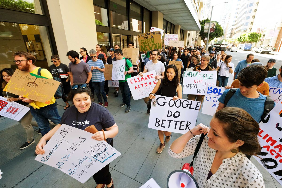 Protesters for the Global Climate Strike hold signs that read, “Google do better,” and, “Climate action now.”