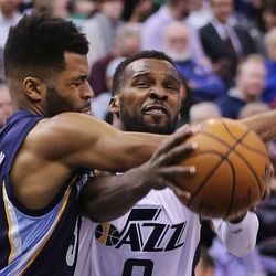 Utah Jazz guard Shelvin Mack (8) is fouled by Memphis Grizzlies guard Andrew Harrison (5) during NBA basketball in Salt Lake City on Monday, Nov. 14, 2016.