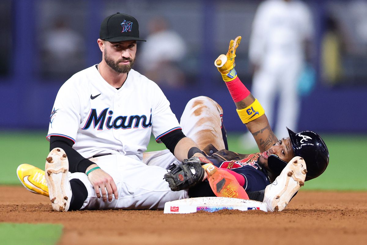 Ronald Acuna Jr. #13 of the Atlanta Braves slides safe to second base against Jon Berti #5 of the Miami Marlins during the sixth inning at loanDepot park on May 02, 2023 in Miami, Florida.