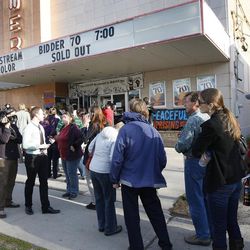 People line up to see "Bidder 70," a documentary that chronicles Tim DeChristopher's experience, at the Tower Theatre on Monday, April 22, 2013, in Salt Lake City.