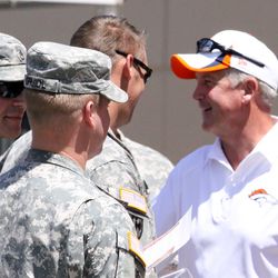 Broncos Head Coach John Fox meets with members of the United States Army after practice