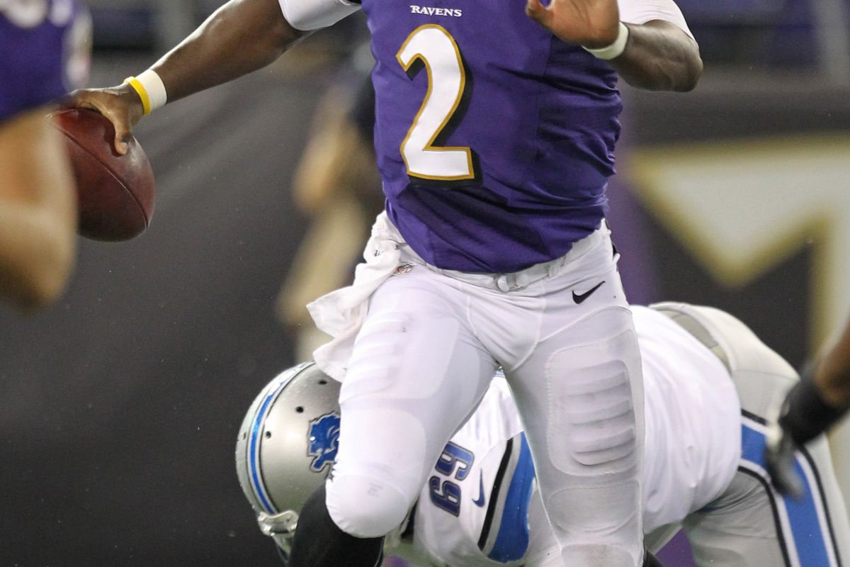 August 17, 2012; Baltimore, MD, USA; Baltimore Ravens quarterback Tyrod Taylor (2) avoids being tackled against the Detroit Lions at M&T Bank Stadium. Mandatory Credit: Mitch Stringer-US PRESSWIRE