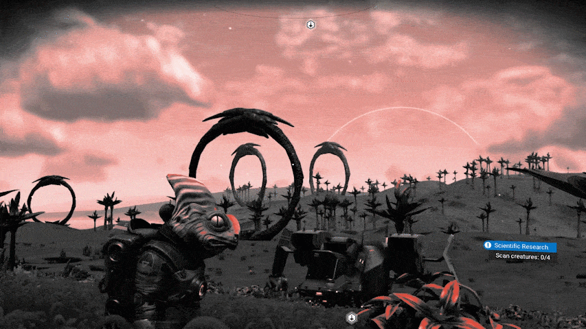 No Man’s Sky - A gif pans across the horizon of an eerie red skied planet with giant stone rings dotting the landscape.