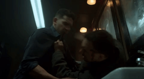 GIF of the Punisher beating up another man