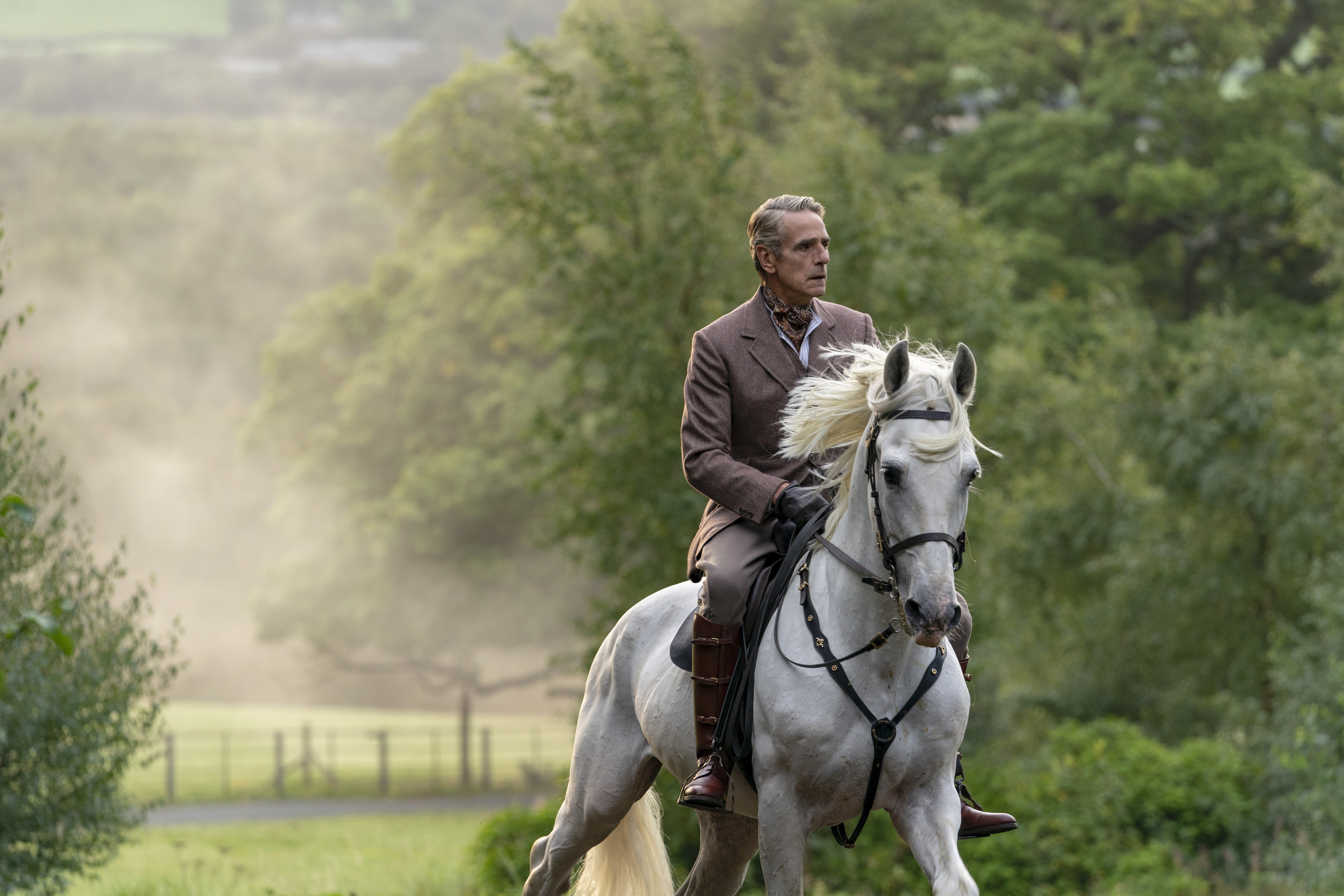 Jeremy Irons rides a horse, innocuously.