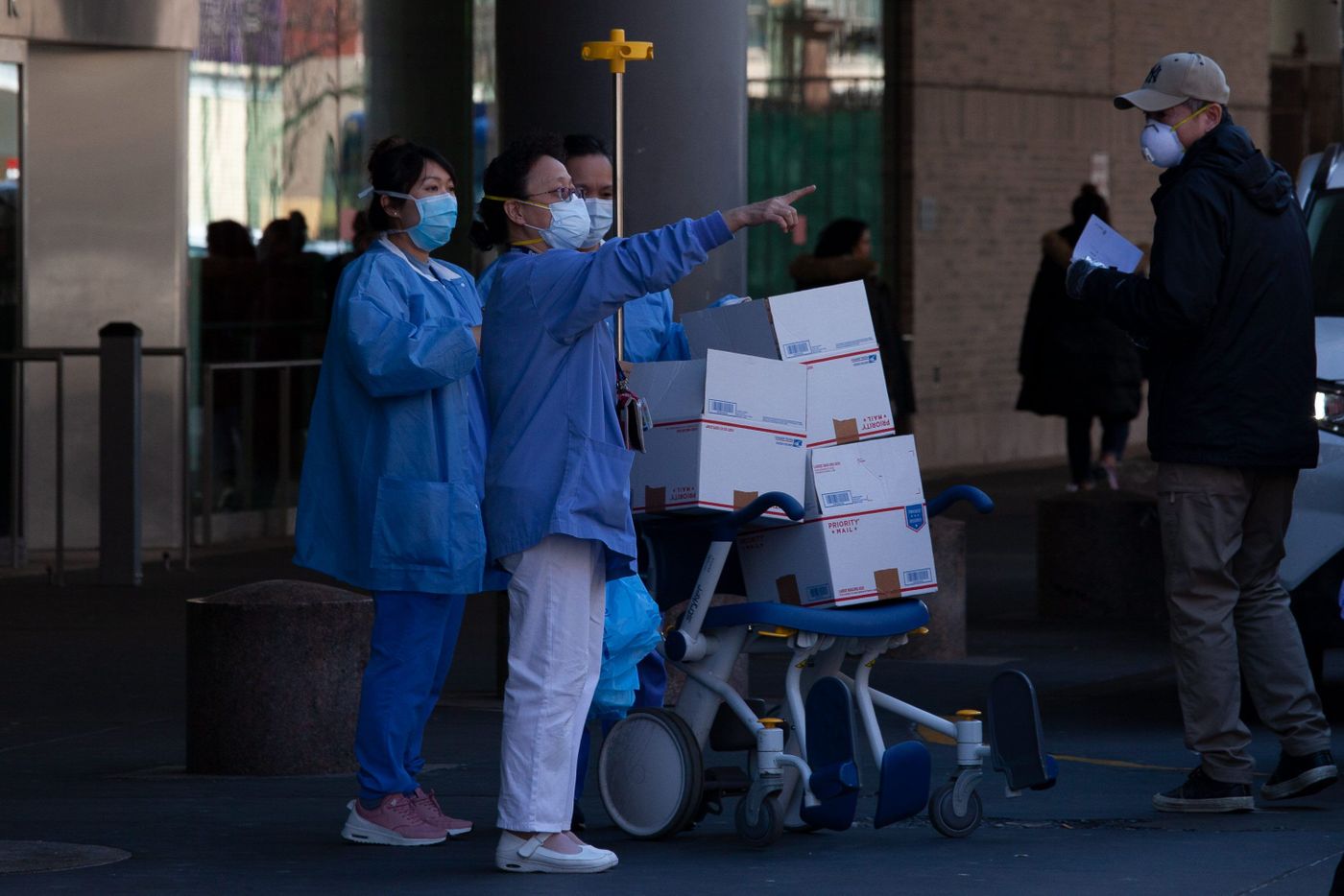 Bellevue Hospital workers accept several packages during the coronavirus outbreak, March 26, 2020.