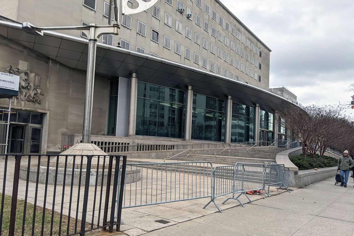 A metal barricade blocked an accessible entrance to Queens County Criminal Court.