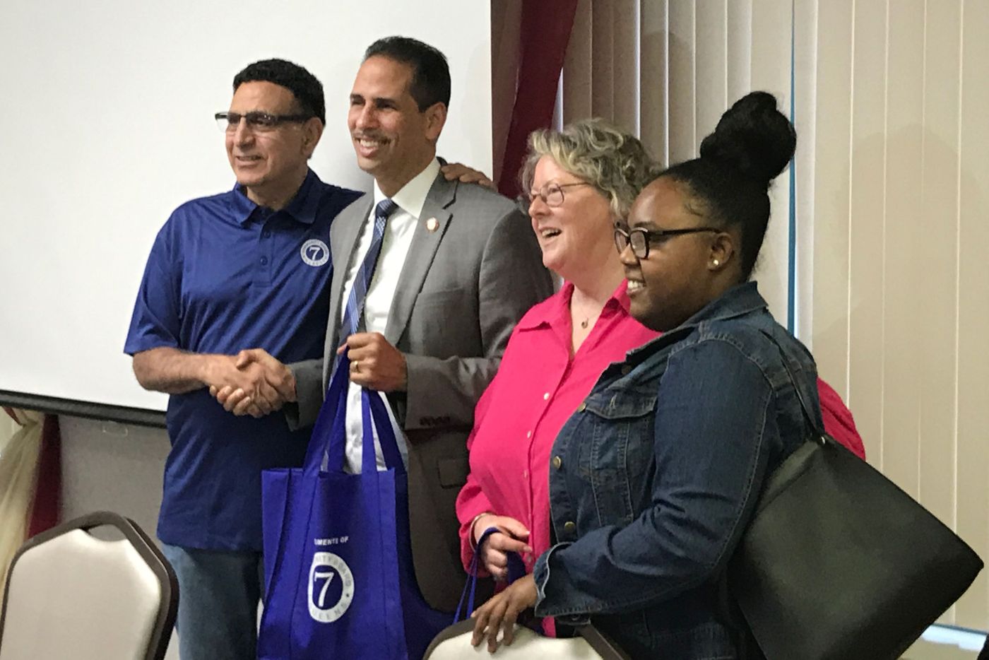 City Councilmember Fernando Cabrera (D-Bronx) holds one of 5,000 tote bags Queens Community Board 7 purchased with public funds, June 17, 2019.