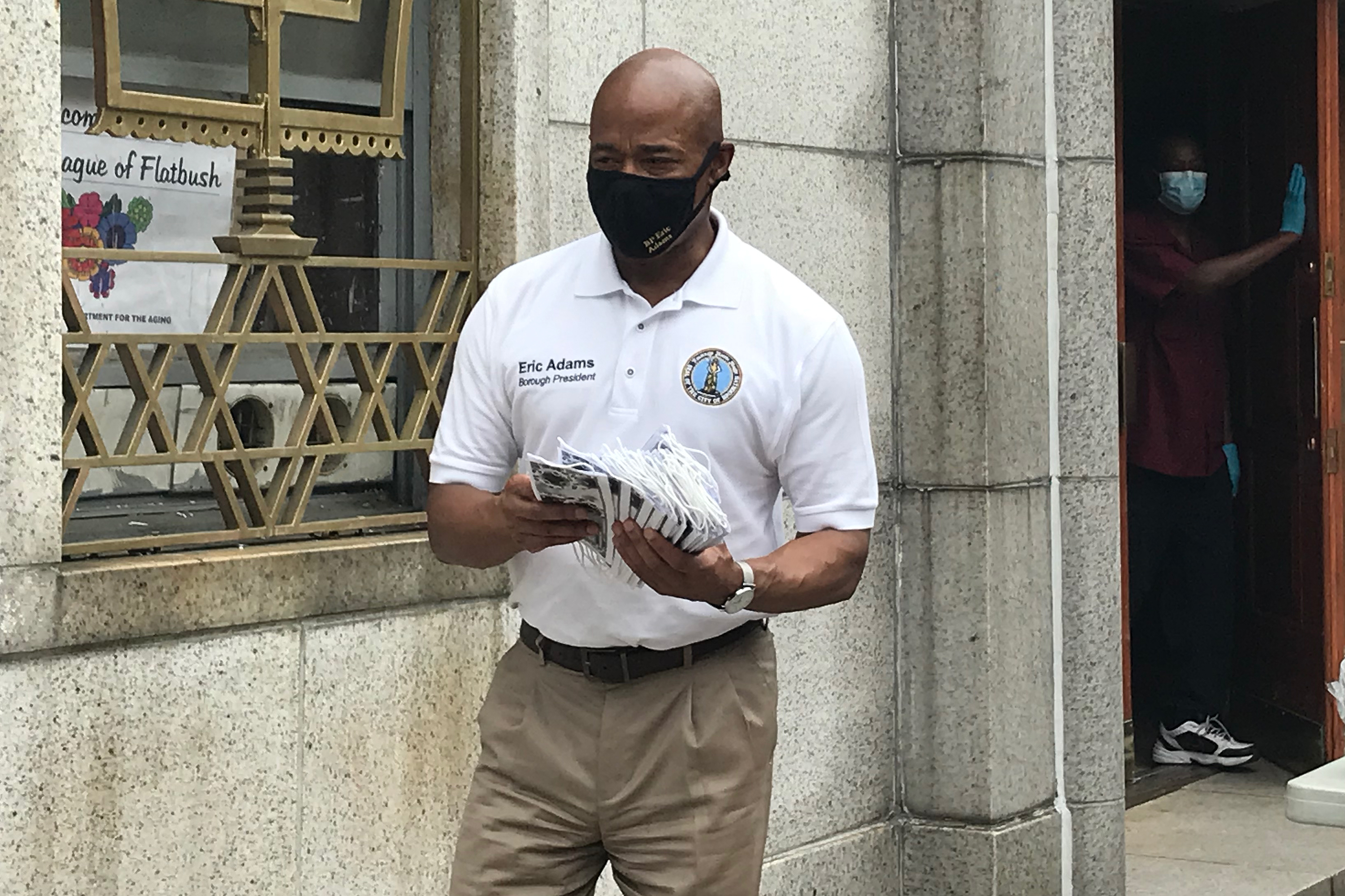 Brooklyn Borough President Eric Adams hands out masks at the East Midwood Jewish Center, June 5.