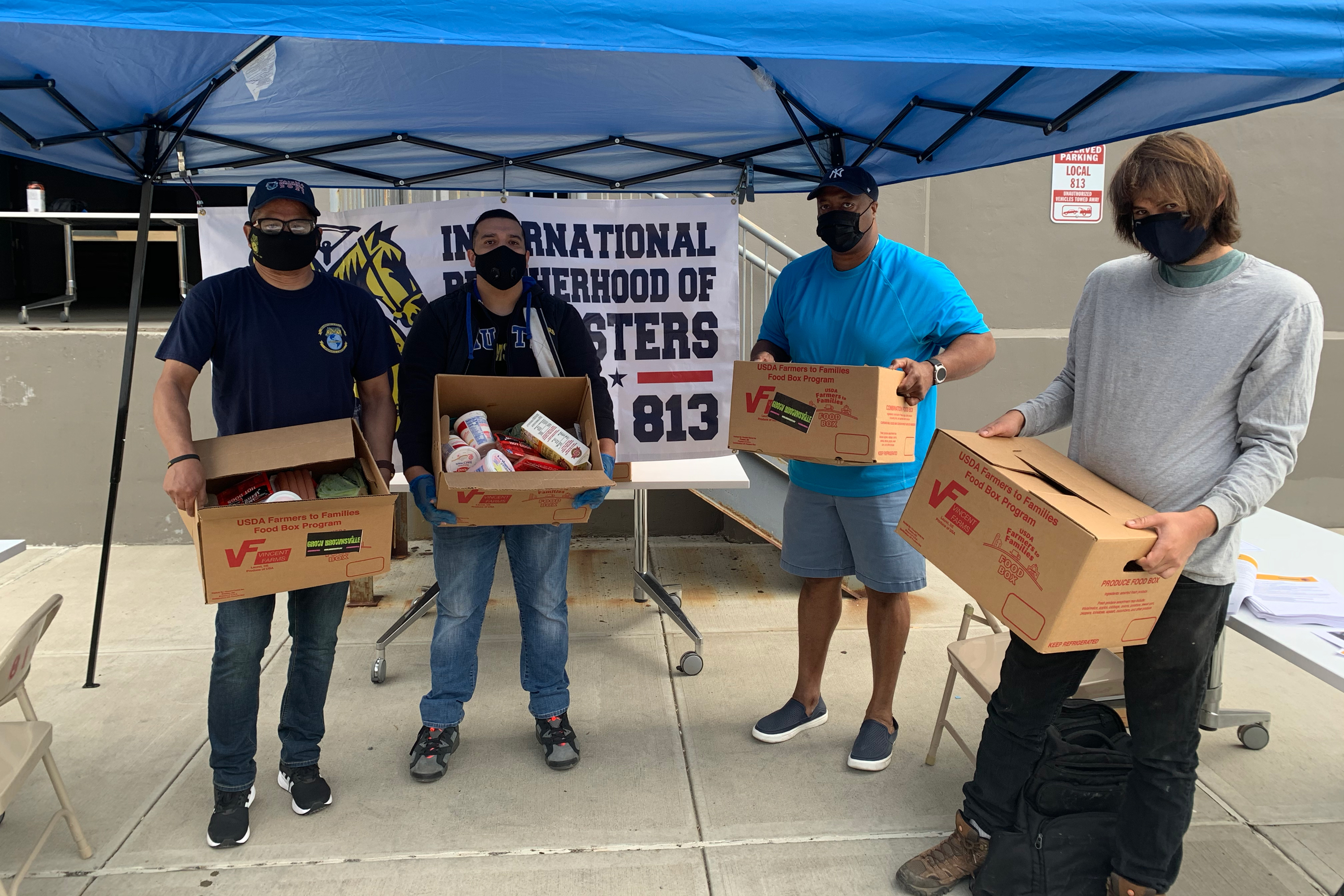 Teamsters Local 813 President Sean Campbell, second from right, takes part in a food relief event in Long Island City, Sept. 29, 2020.
