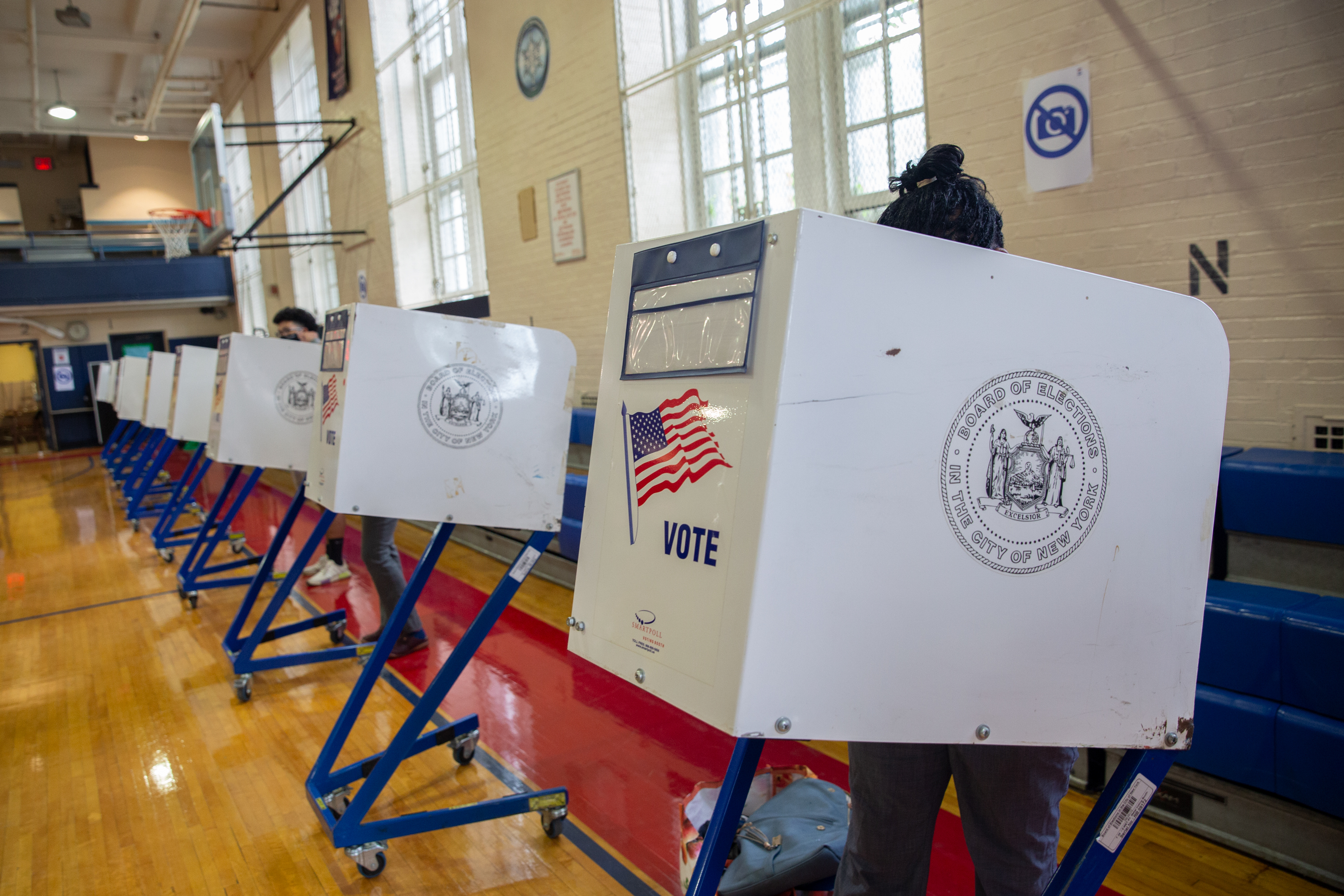 People take part in early voting at the Erasmus Educational Complex in Brooklyn, June 14, 2021.